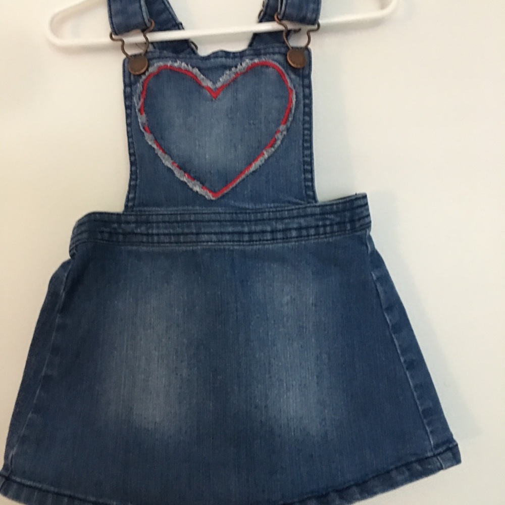 Blue overall with red heart in the middle